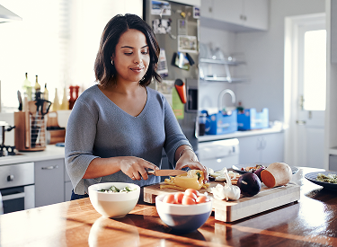 Woman preparing food in kitchen